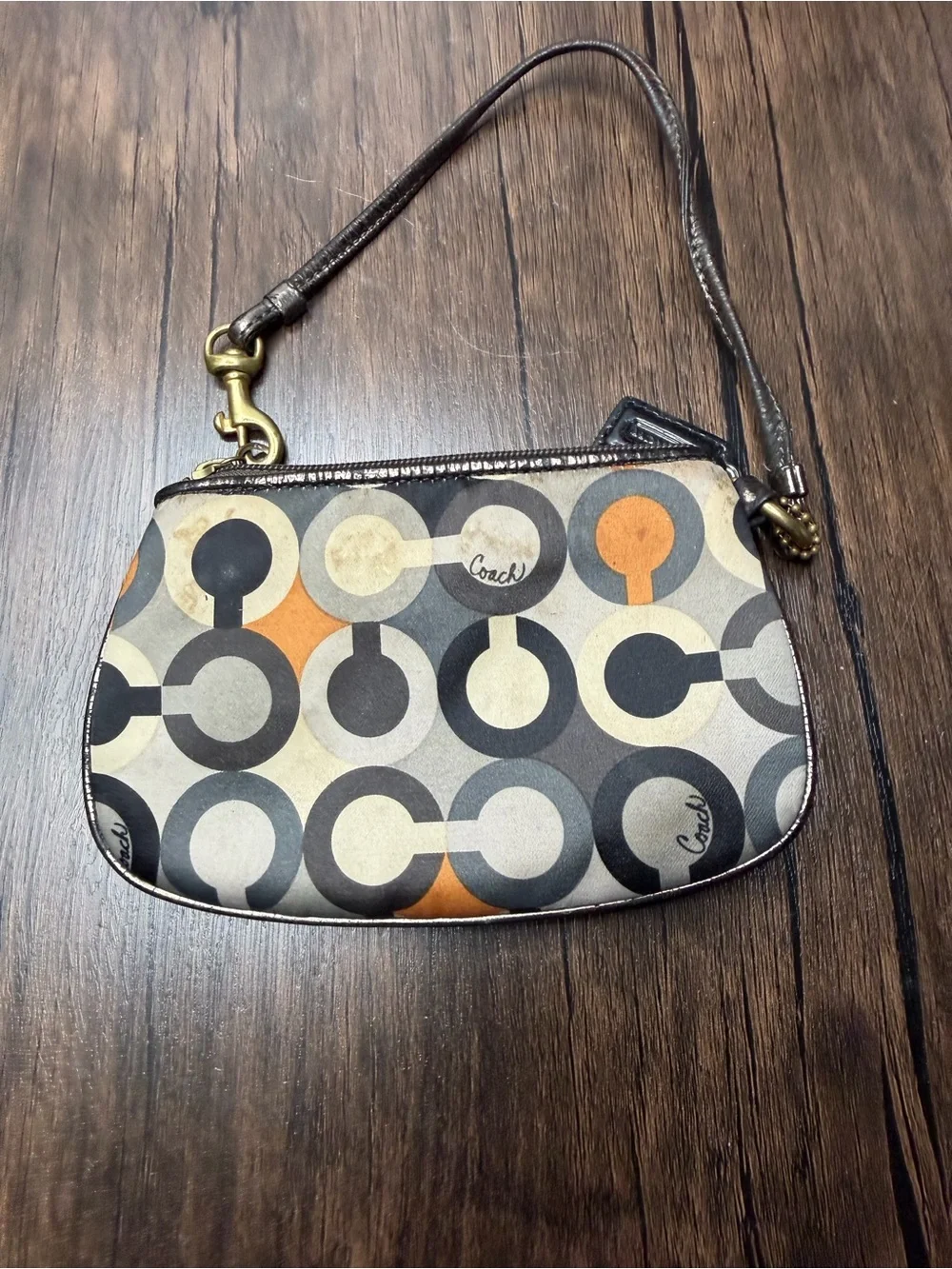 Coach Madison Graphic Op Art sateen Wristlet in Brown and Orange Accents